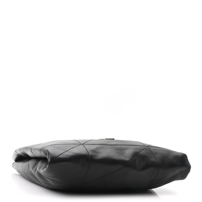Black quilted leather bag base close-up with stitched diamond pattern