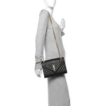 Black quilted medium satchel with YSL monogram, gold chain shoulder strap