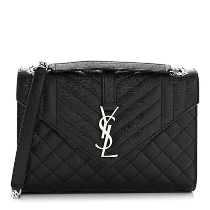 Black quilted satchel bag with YSL monogram on front flap, top handle and chain strap