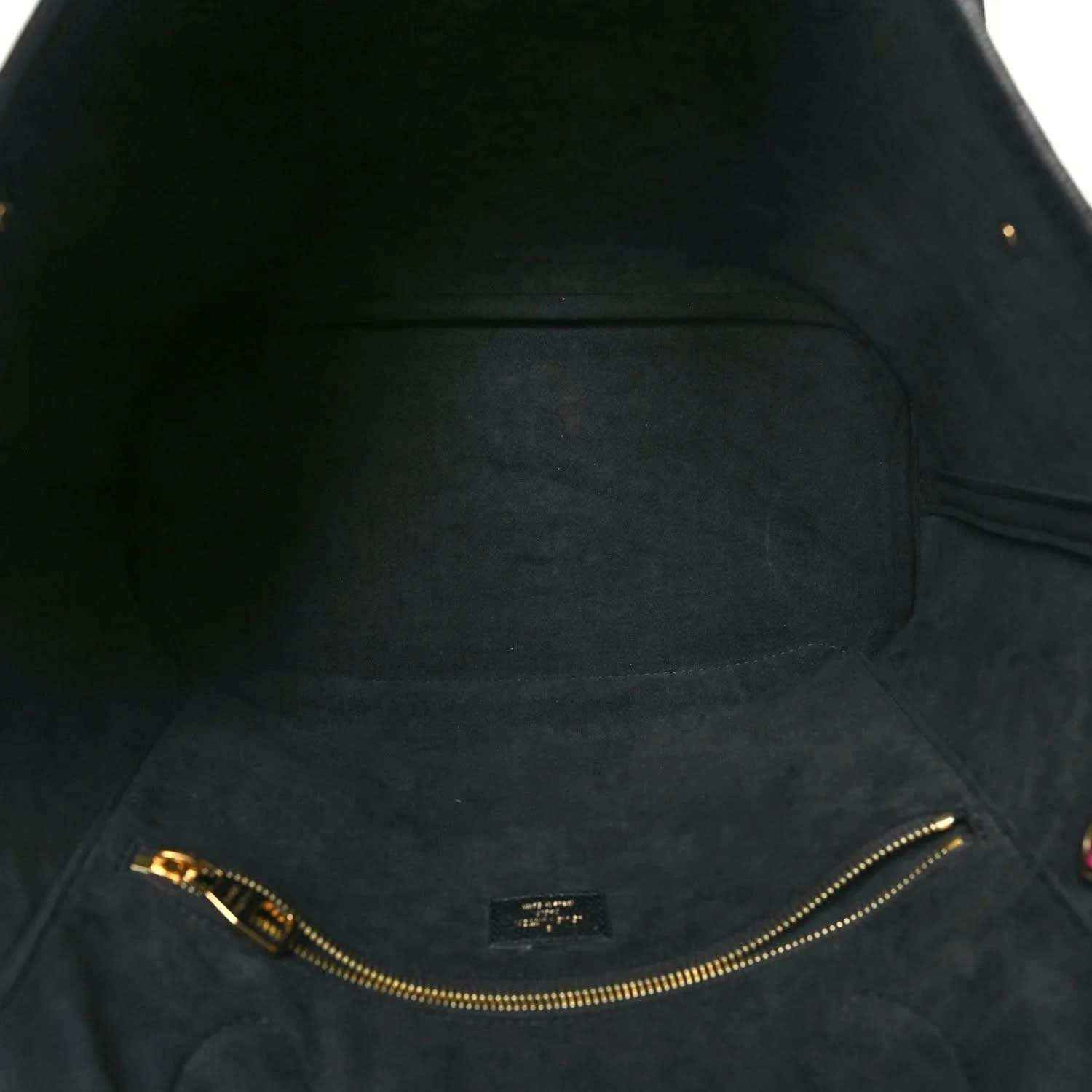 Neverfull MM pouch interior lining with gold-tone zipper track and stitching