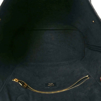 Neverfull MM pouch interior lining with gold-tone zipper track and stitching