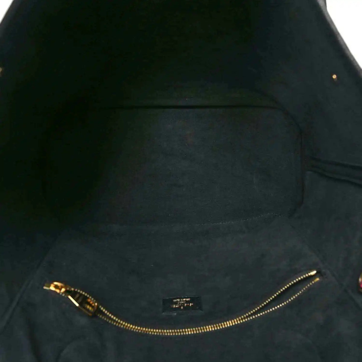 Neverfull MM pouch interior lining with gold-tone zipper track and stitching