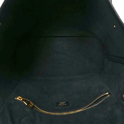 Neverfull MM pouch interior lining with gold-tone zipper track and stitching