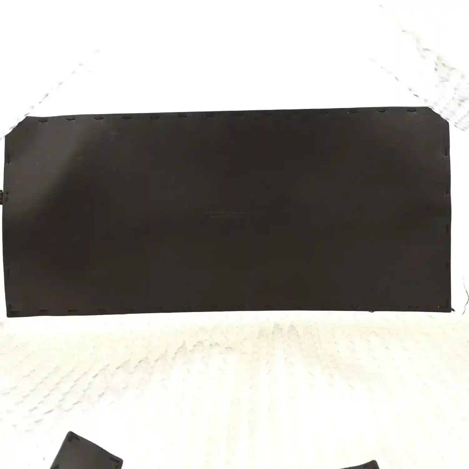Black leather wallet-style pouch insert with stitched edge