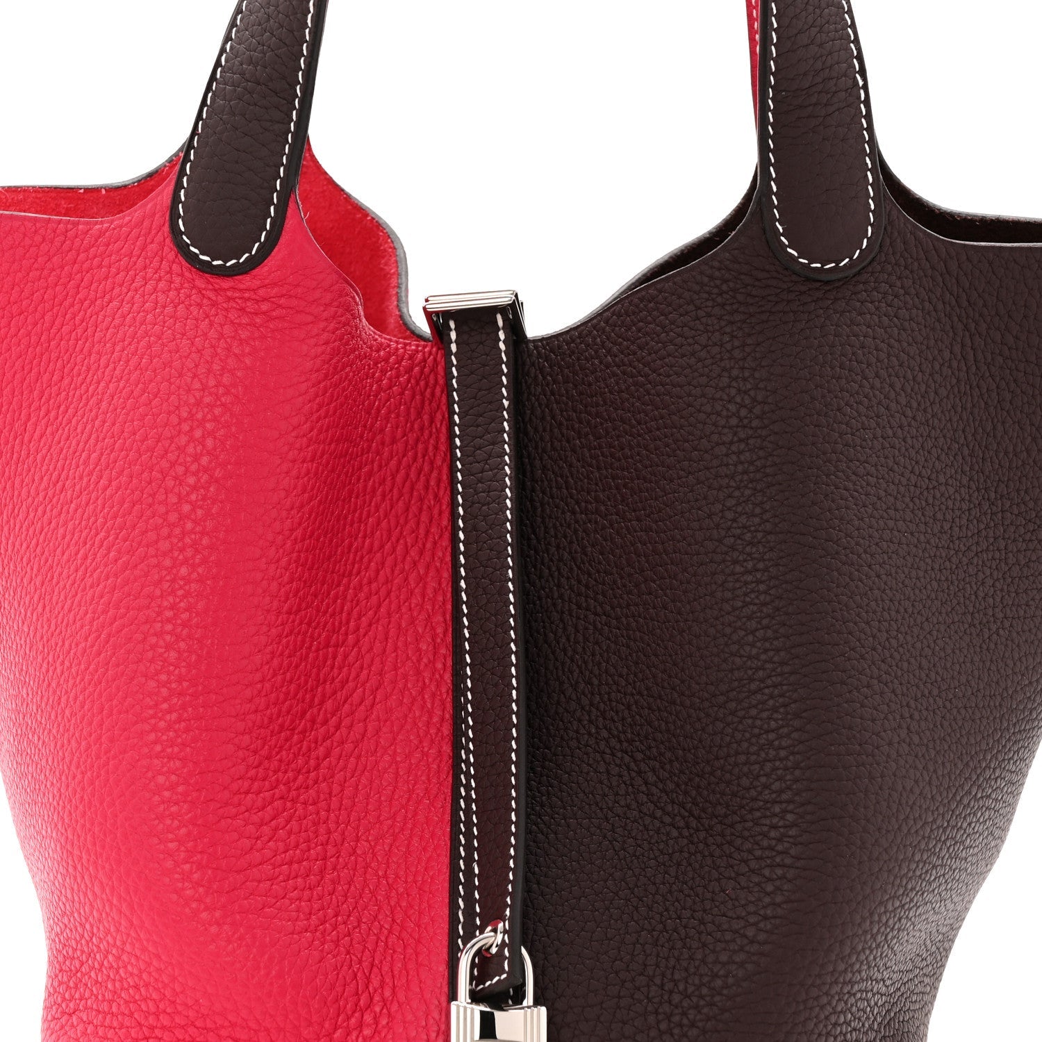 Two-tone bag zipper pull and strap with white contrast stitching on dark brown trim