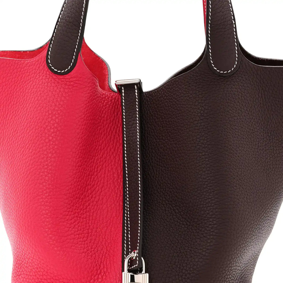 Two-tone bag zipper pull and strap with white contrast stitching on dark brown trim