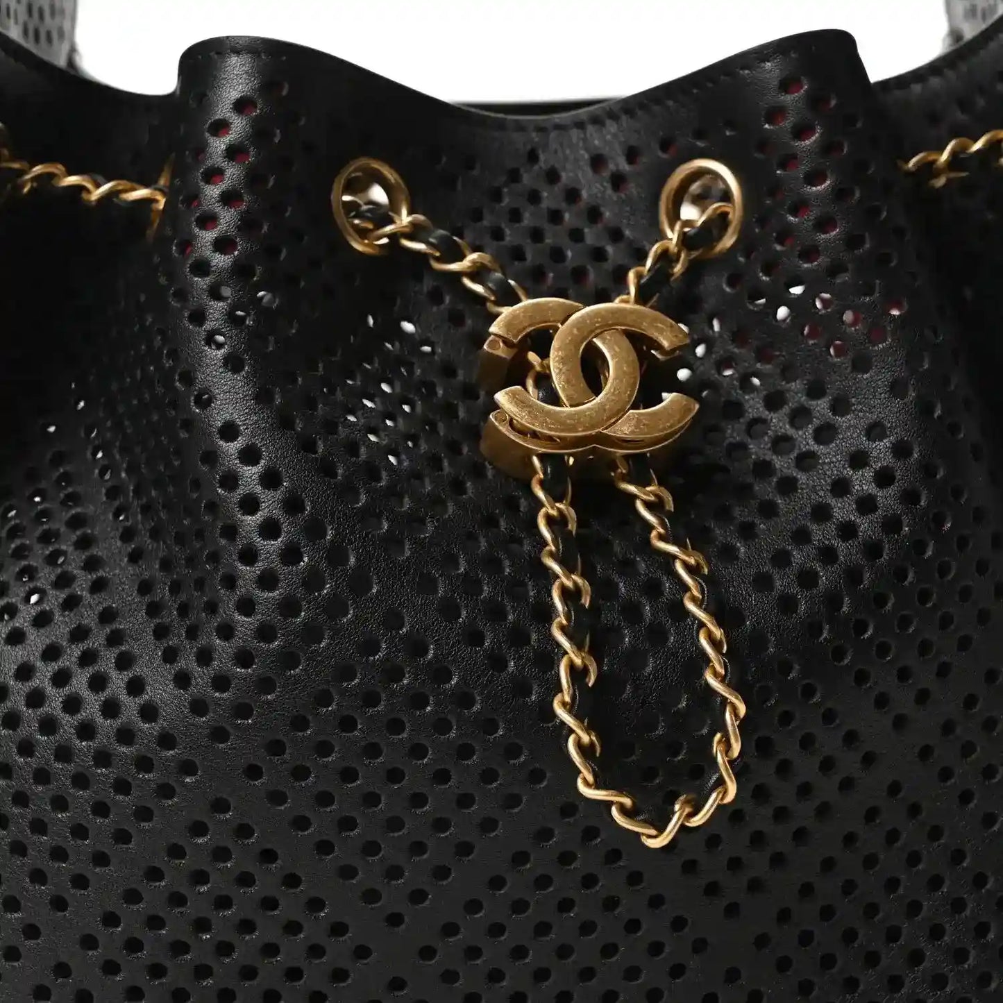 Small black perforated handbag with gold chain drop and CC emblem