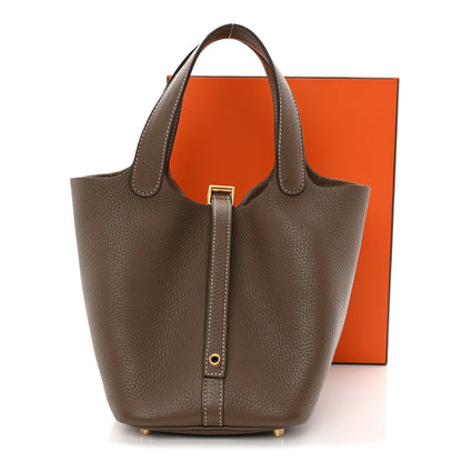 Taupe calfskin leather Picotin-style bucket bag with top lock and handles