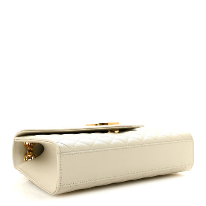 Cream quilted satchel side view with gold chain and top hardware