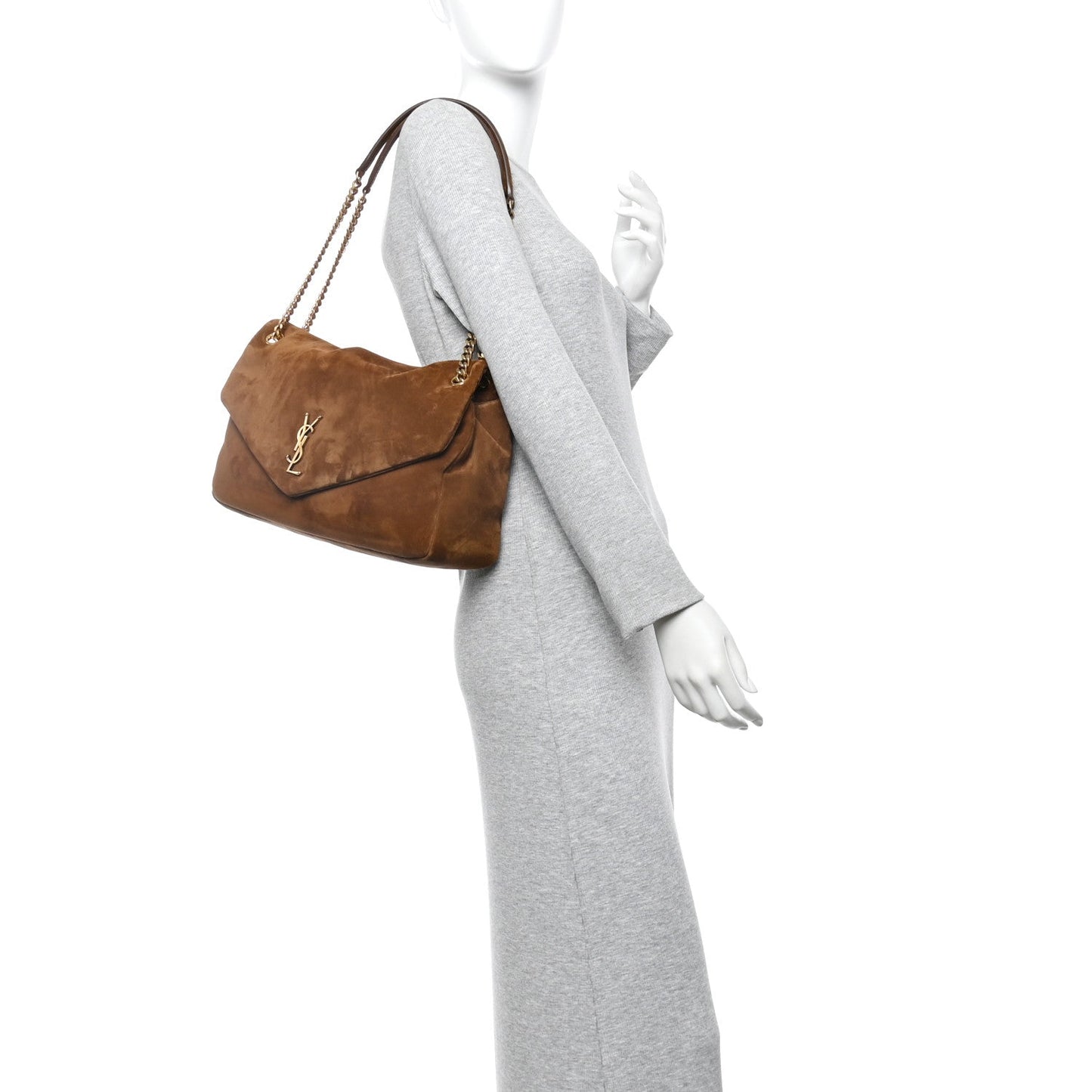 Saint Laurent suede shoulder bag in caramel cognac worn on chain shoulder strap.