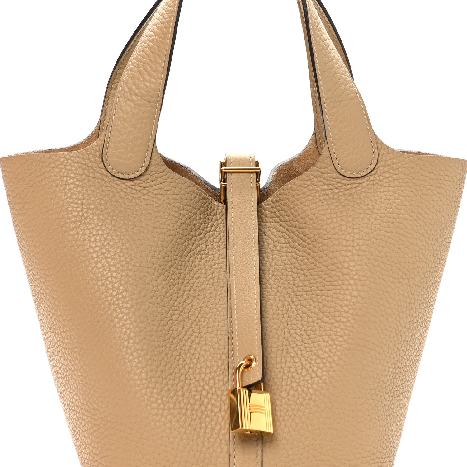Beige leather tote with top handles and gold lock bar closure detail