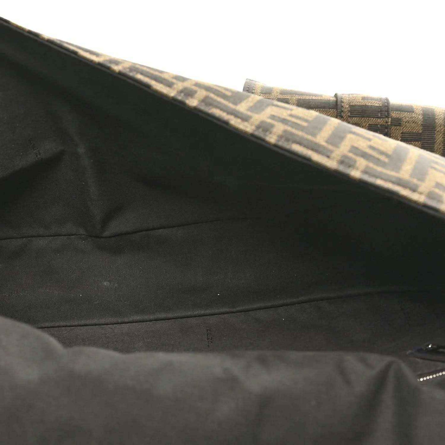 Baguette bag interior lining near top edge, dark fabric with Zucca trim.