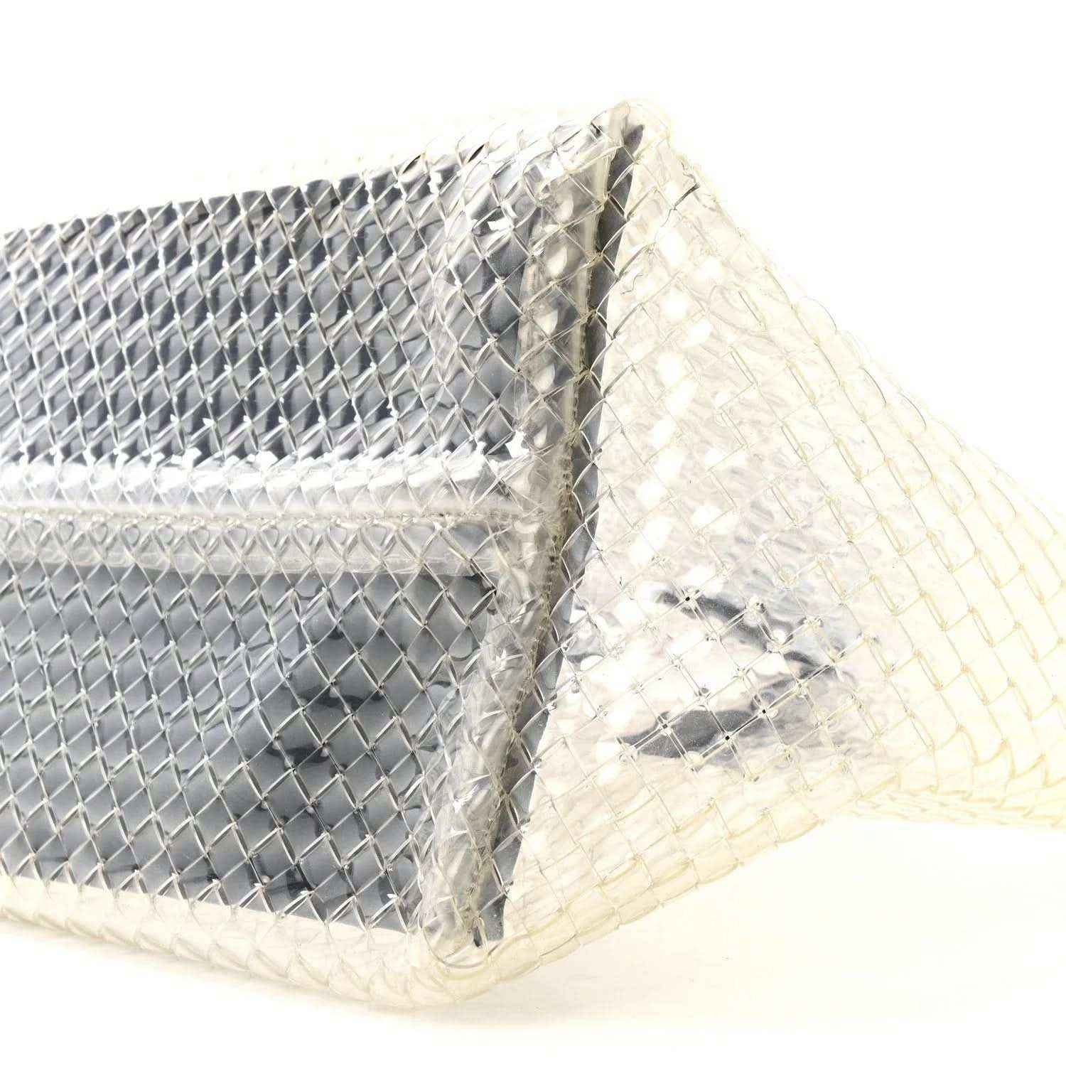 Close-up of woven PVC tote corner with silver-tone panel and white lining