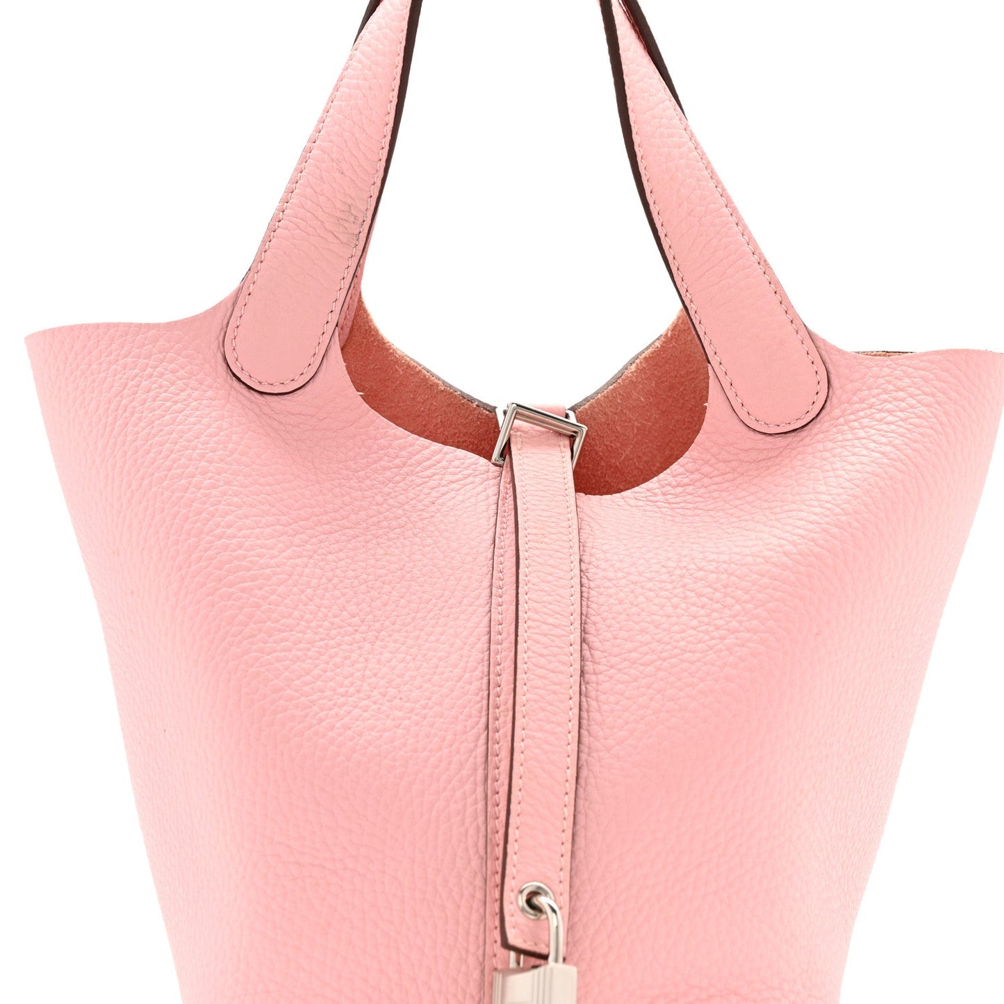 Rose pink leather handbag front with drawstring closure and metal ring