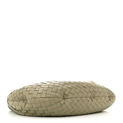 Small woven leather bag base view, rounded shape, travertine light taupe