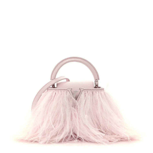 Louis Vuitton mini top-handle bag with pale pink handle and feather-front fringe