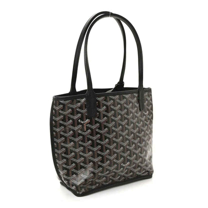Reversible mini tote bag with black-and-gray patterned canvas and black leather handles