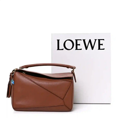 Loewe small brown leather puzzle bag with top handle and front flap seam