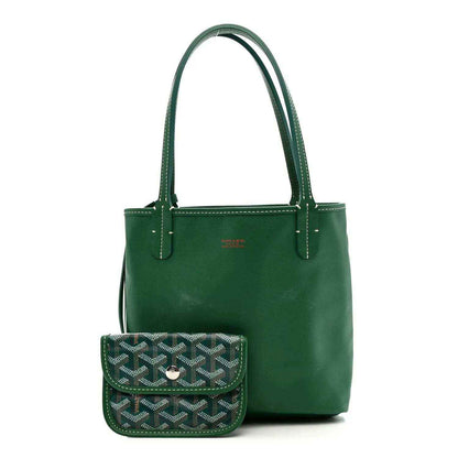 Green reversible mini tote bag with solid green front and matching top handles