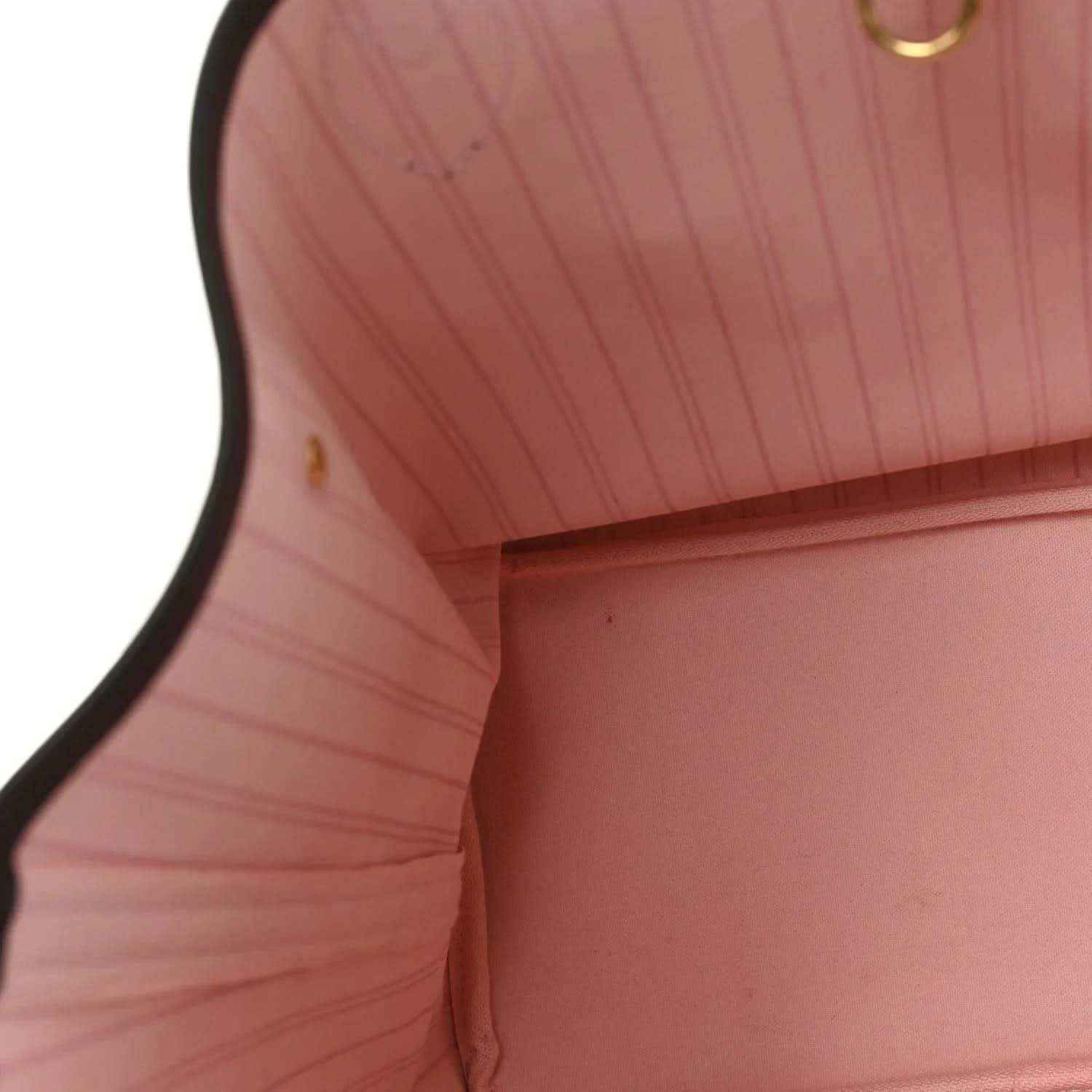 Neverfull tote interior with light pink fabric lining and stitched edge