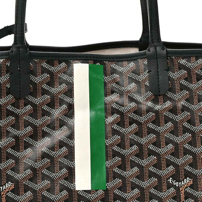 Black patterned tote panel with green-and-white stripe and top handles