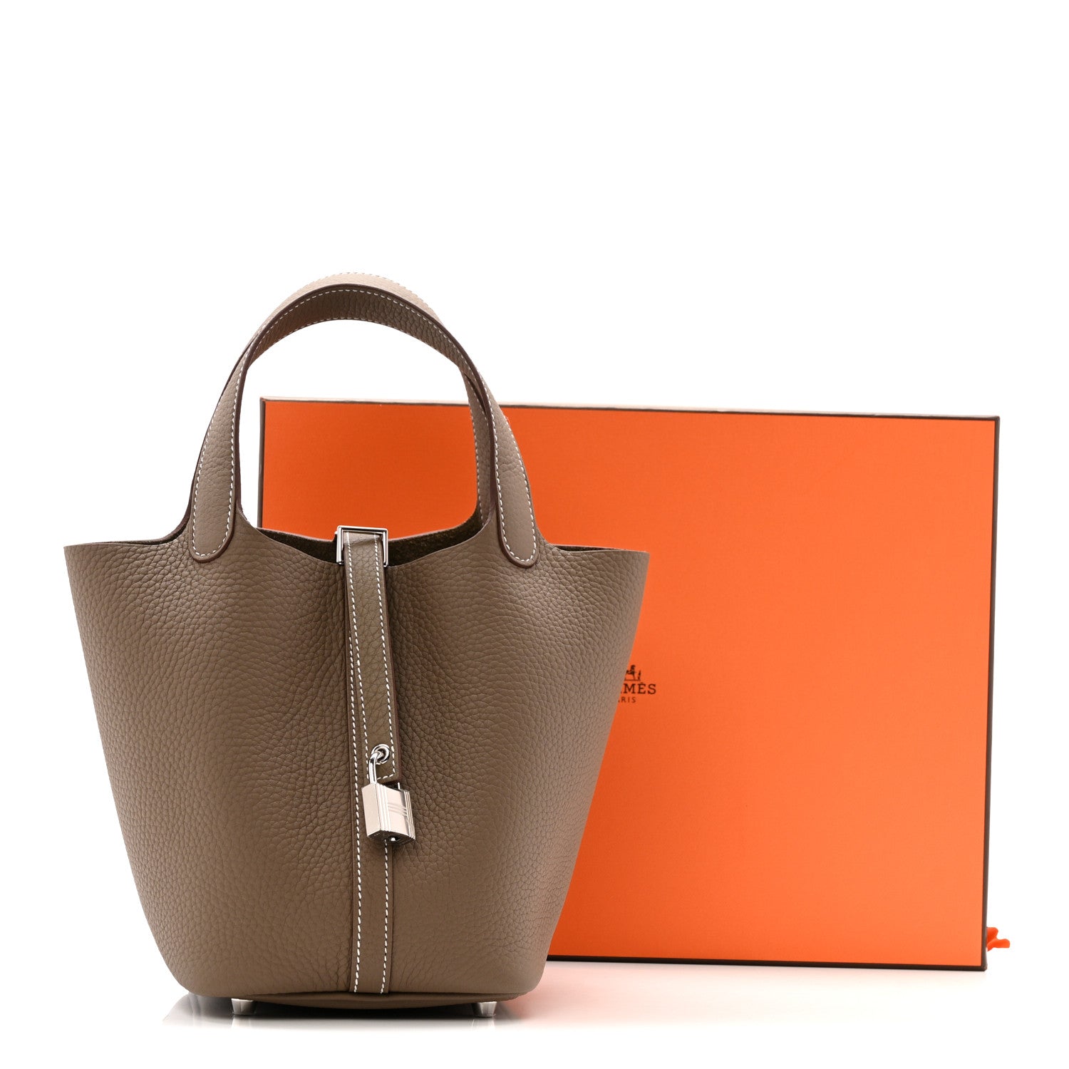Front-facing etoupe leather tote bag with lock clasp and two top handles