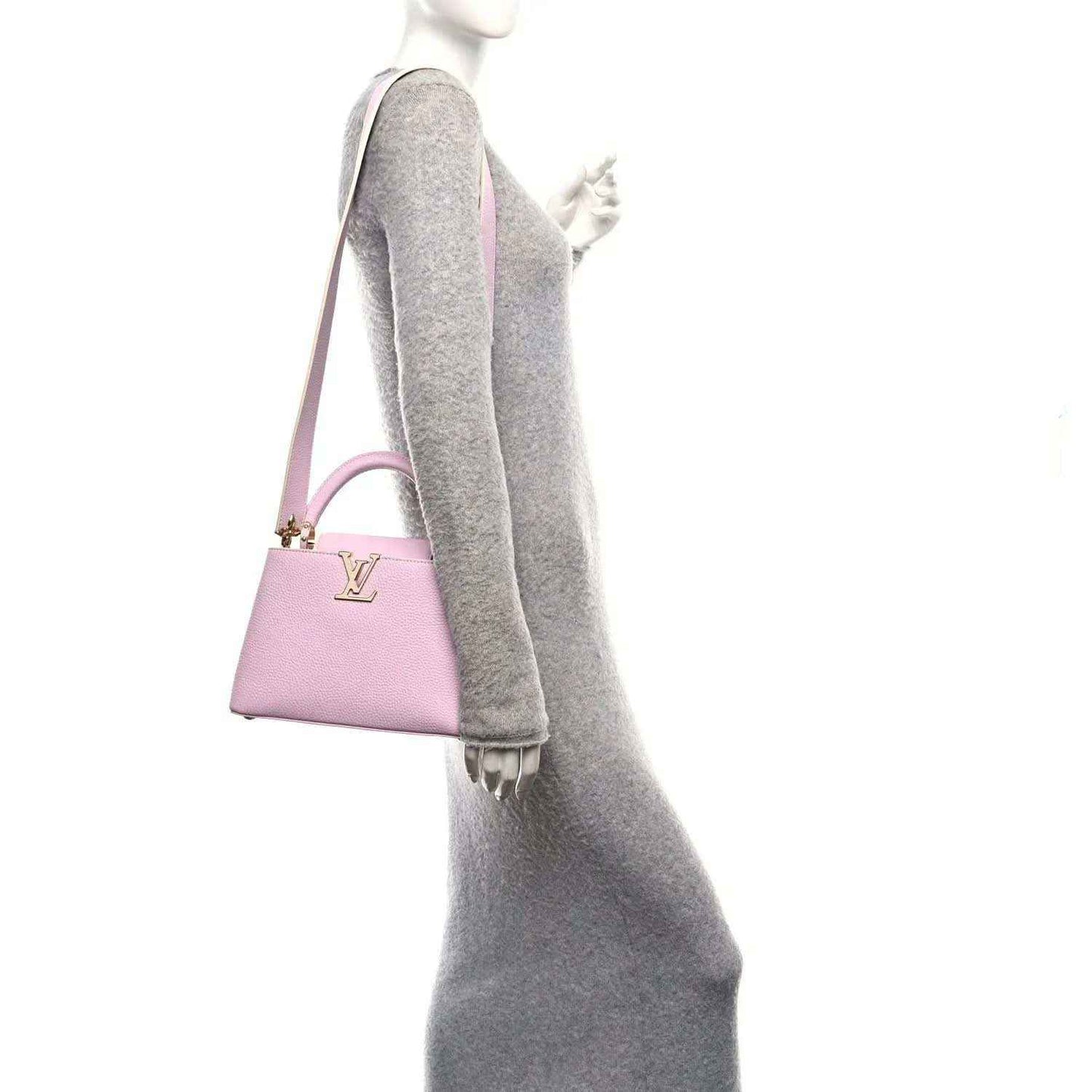 Guimauve pink leather mini handbag with top handle and adjustable shoulder strap