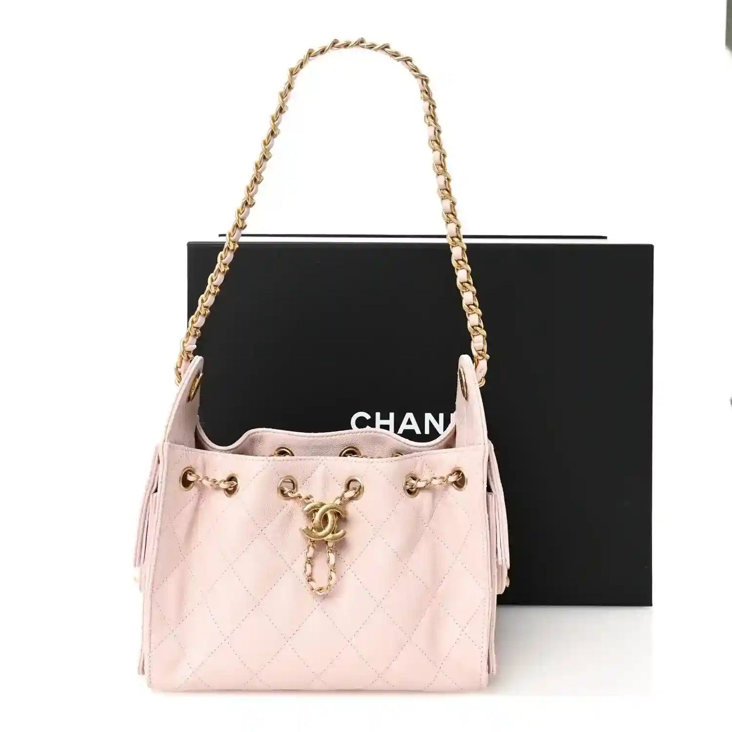Light pink Chanel mini quilted leather handbag with shoulder chain and CC charm
