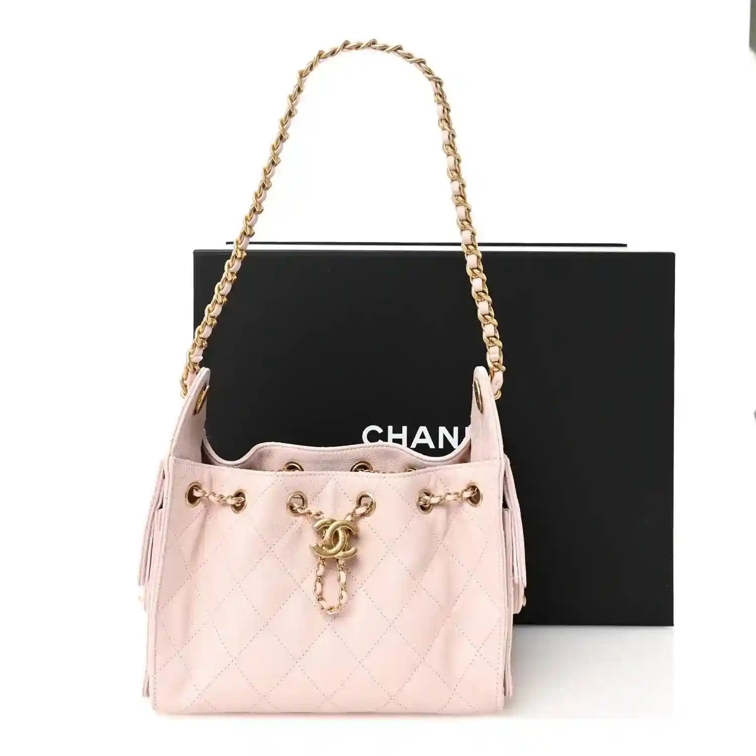 Light pink Chanel mini quilted leather handbag with shoulder chain and CC charm
