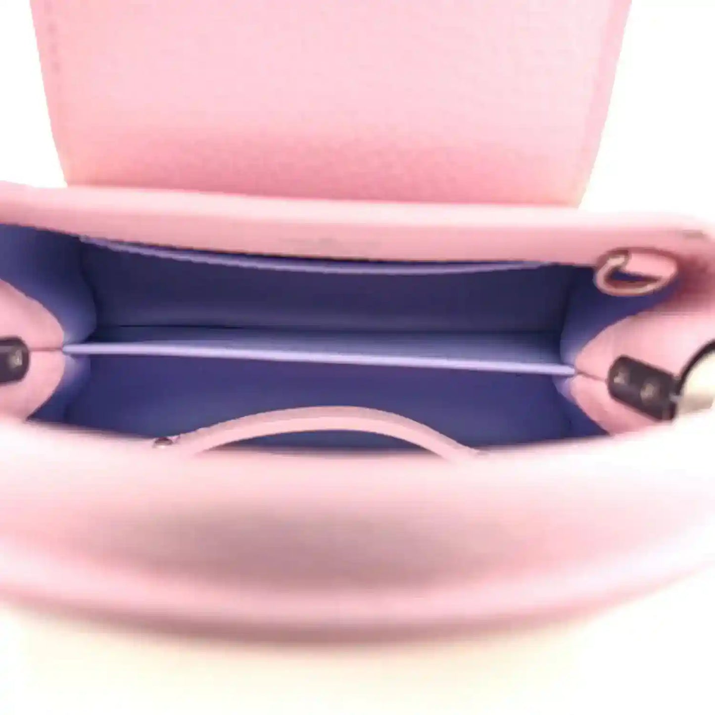 Mini Capucines bag interior view with pink leather lining and side wall stitching