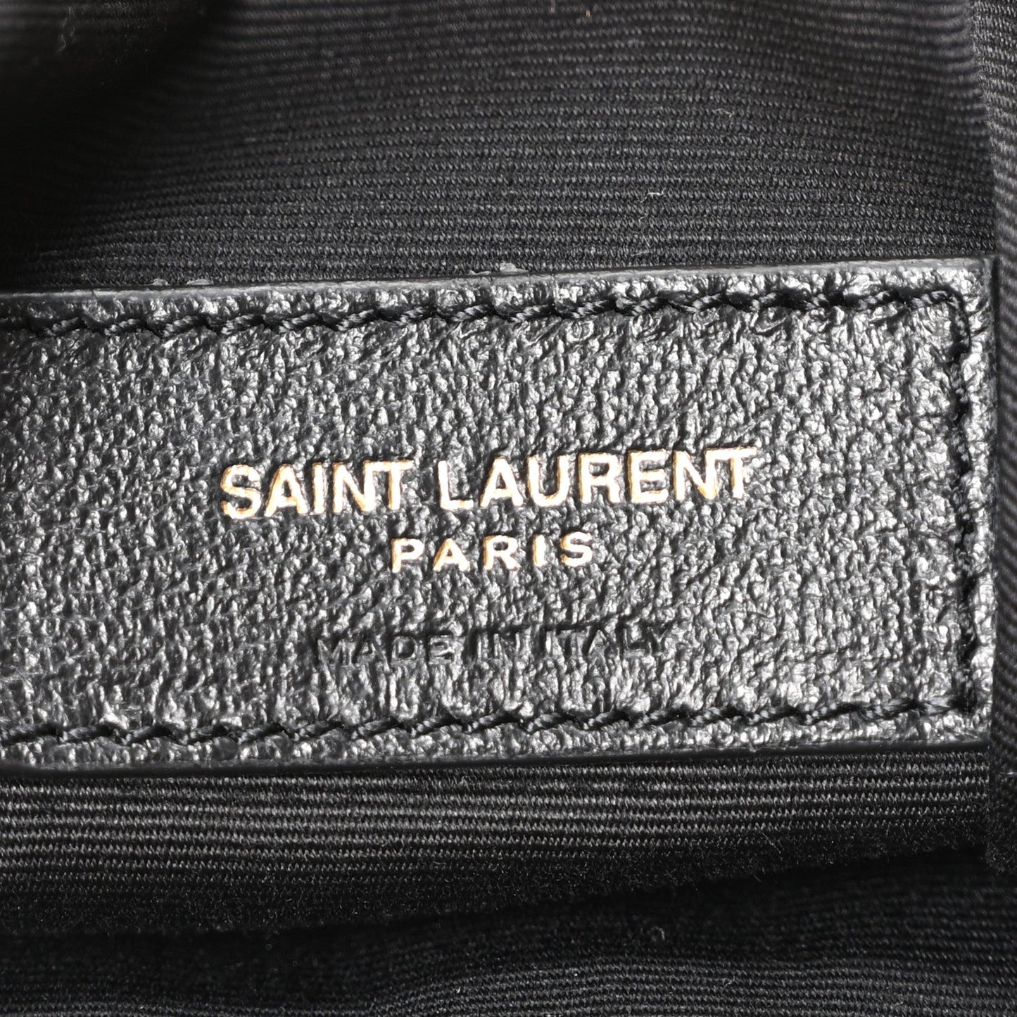 Saint Laurent Paris logo label on interior lining of suede tote bag