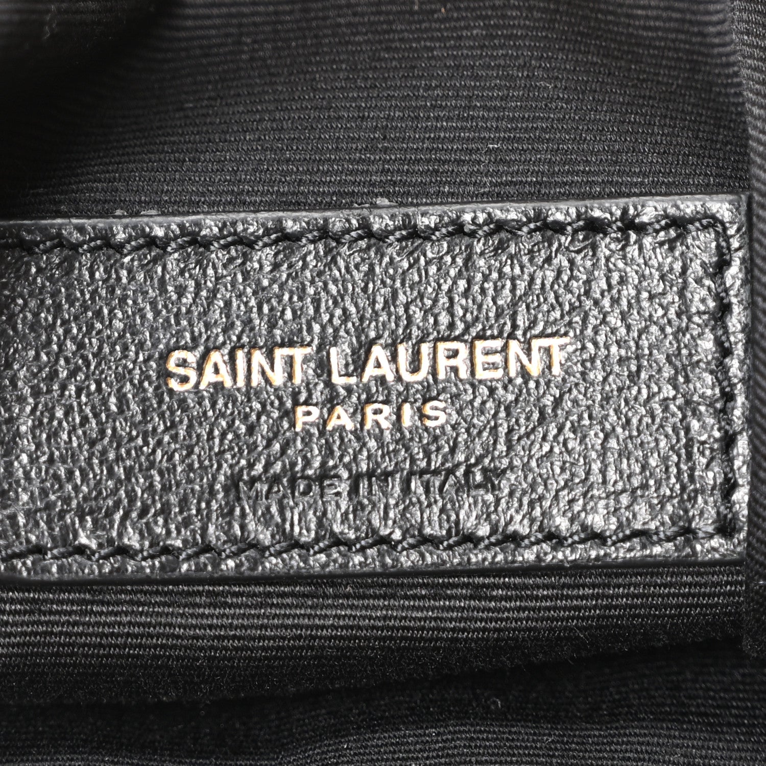 Saint Laurent Paris logo label on interior lining of suede tote bag