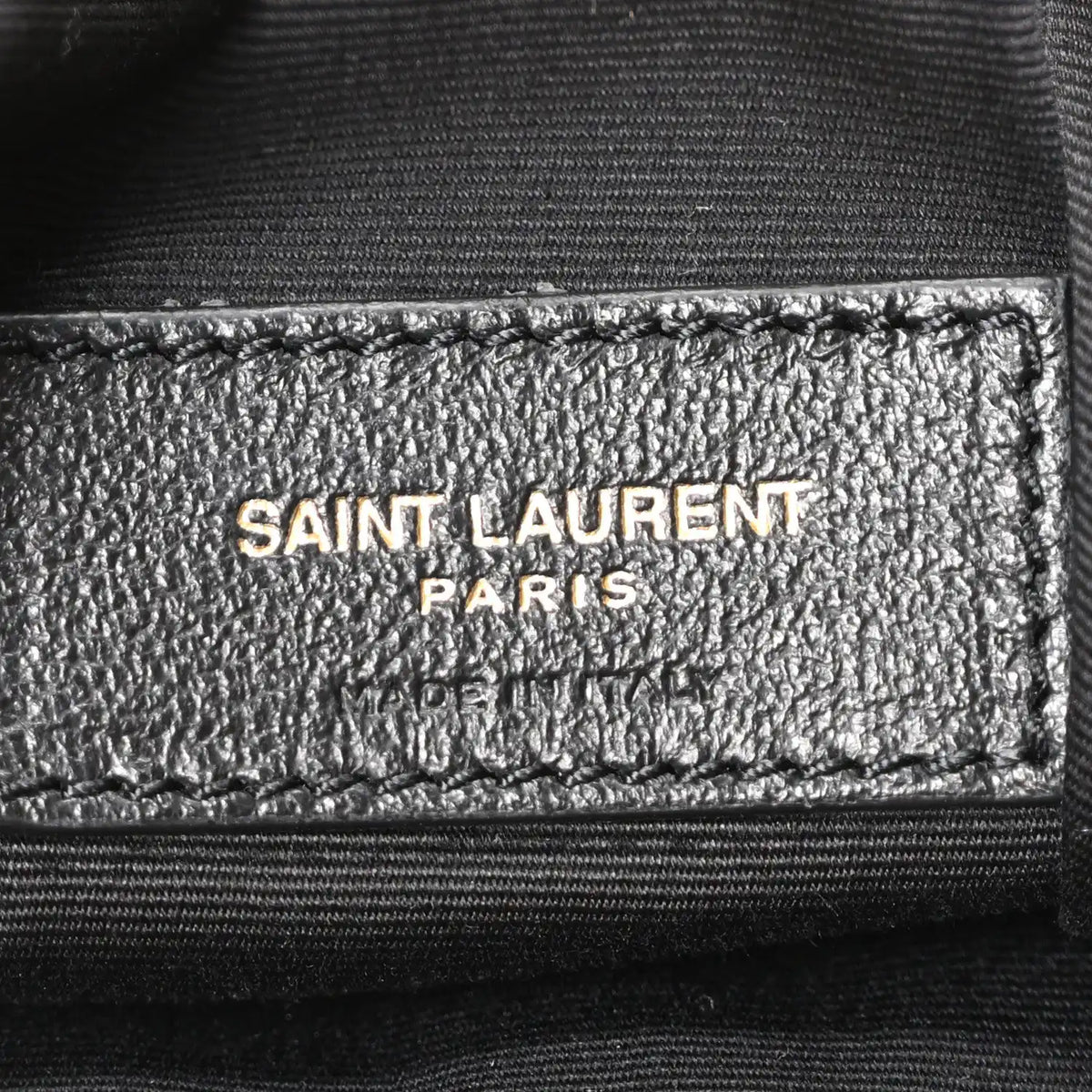 Saint Laurent Paris logo label on interior lining of suede tote bag