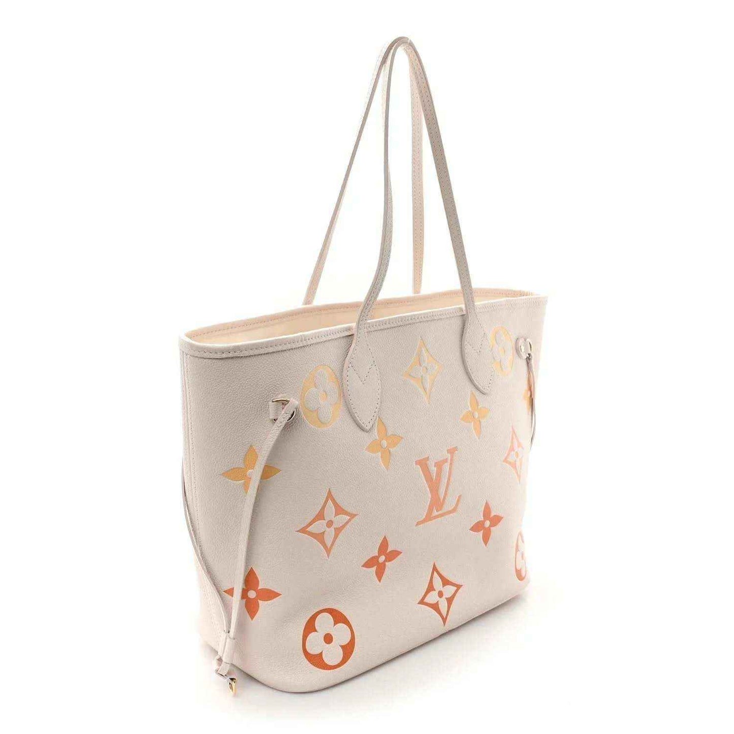 Neutral tote bag with monogram flower and diamond pattern, side view with straps