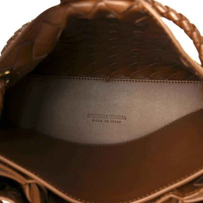 Amber suede interior of shoulder bag with printed brand logo