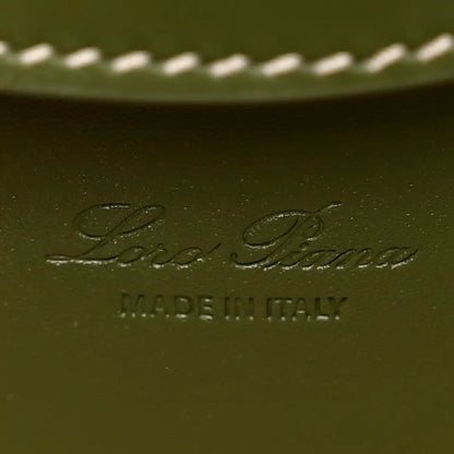 Olive green leather interior panel with embossed Loro Piana logo and MADE IN ITALY