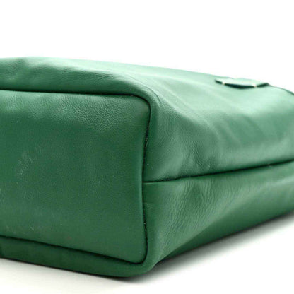Green leather tote corner with rounded profile and stitched edge
