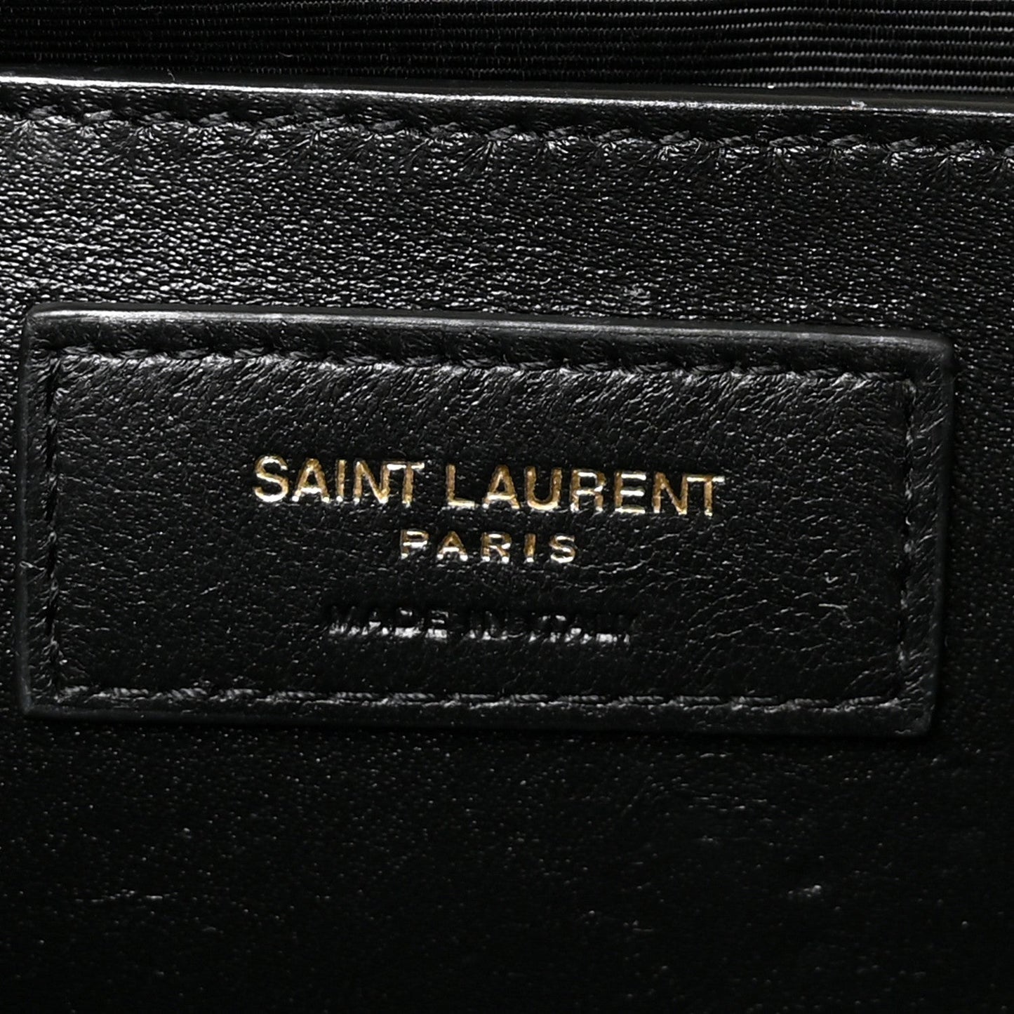 Saint Laurent Paris leather logo patch on black satchel lining