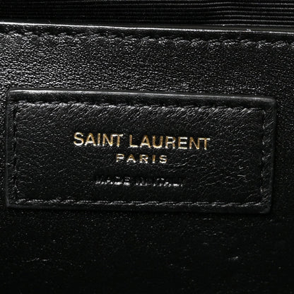 Saint Laurent Paris leather logo patch on black satchel lining