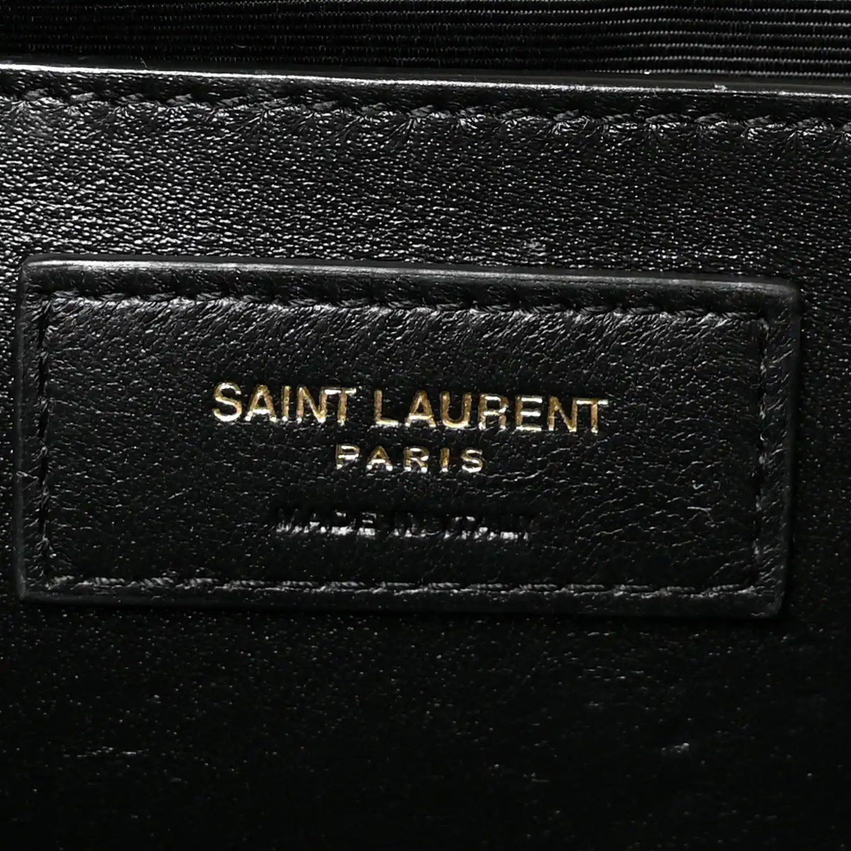 Saint Laurent Paris leather logo patch on black satchel lining
