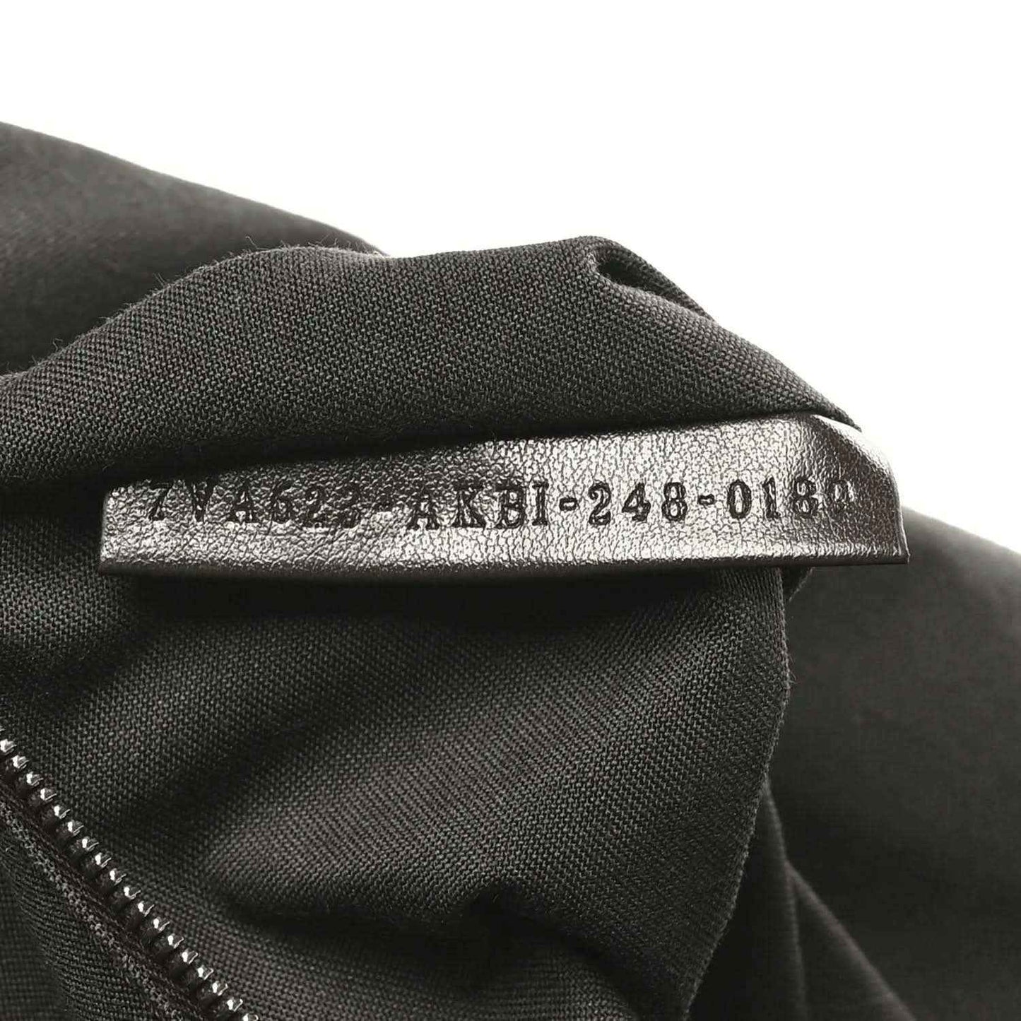 Fendi Baguette fabric size tag on dark lining, '4M8-248-018' text visible.
