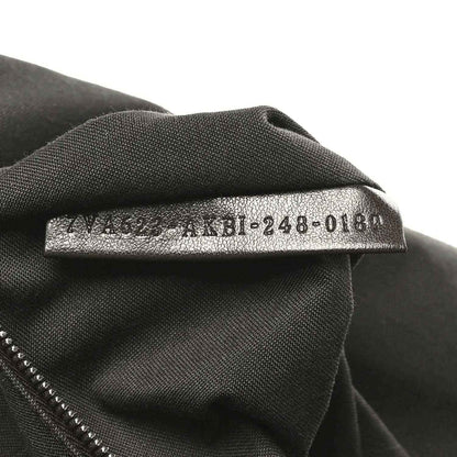 Fendi Baguette fabric size tag on dark lining, '4M8-248-018' text visible.
