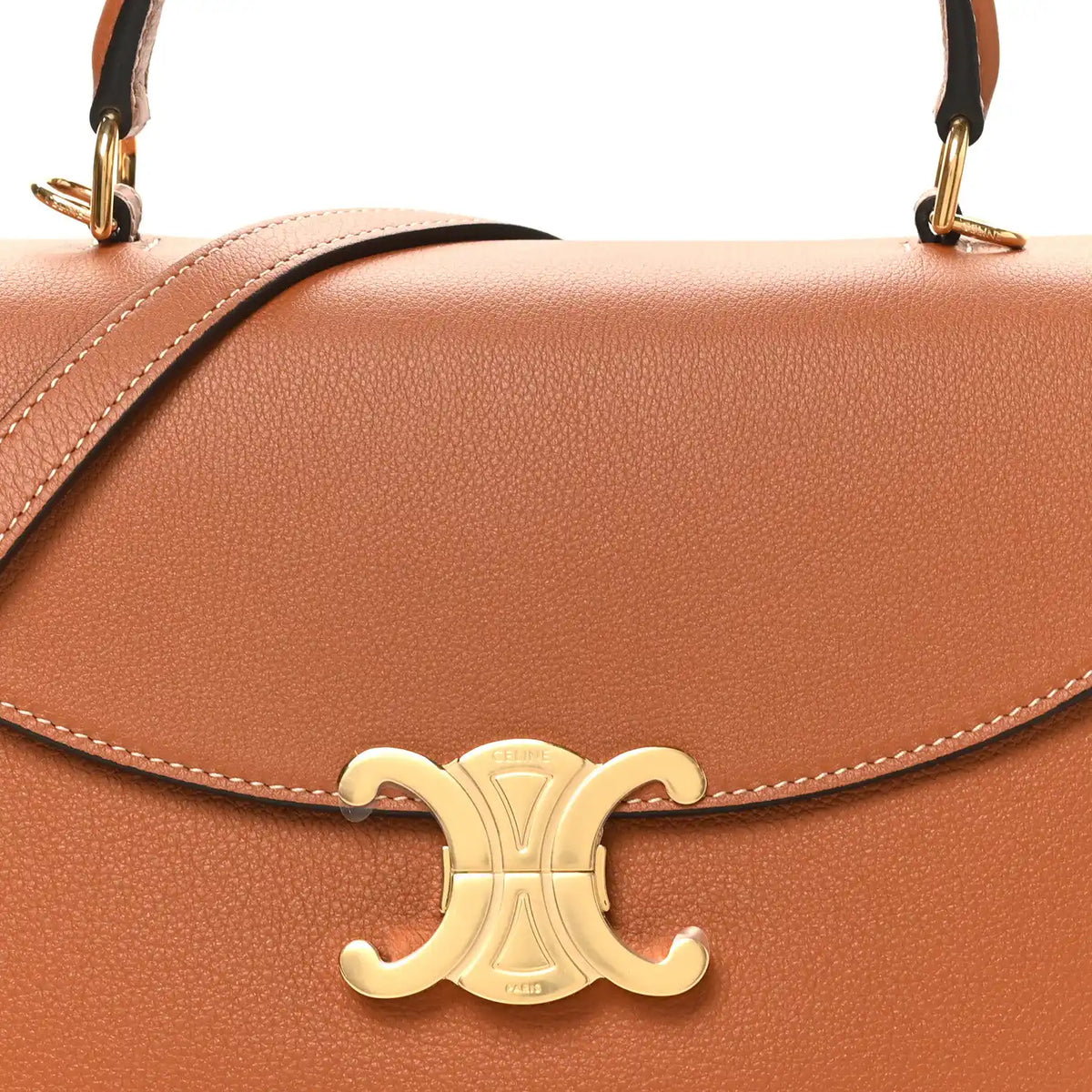 Tan leather handbag flap with gold C-logo clasp and contrast stitching