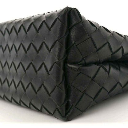Black leather shoulder bag side with intrecciato weave and stitched folded panels