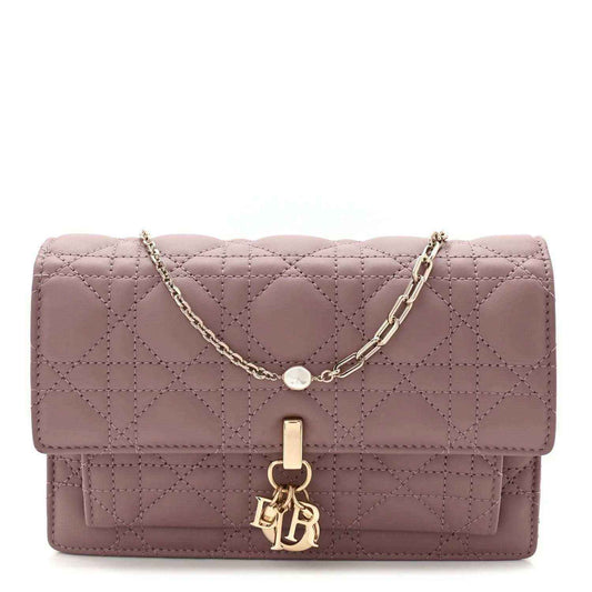 Purple quilted leather chain pouch bag with flap closure and gold-tone emblem hardware