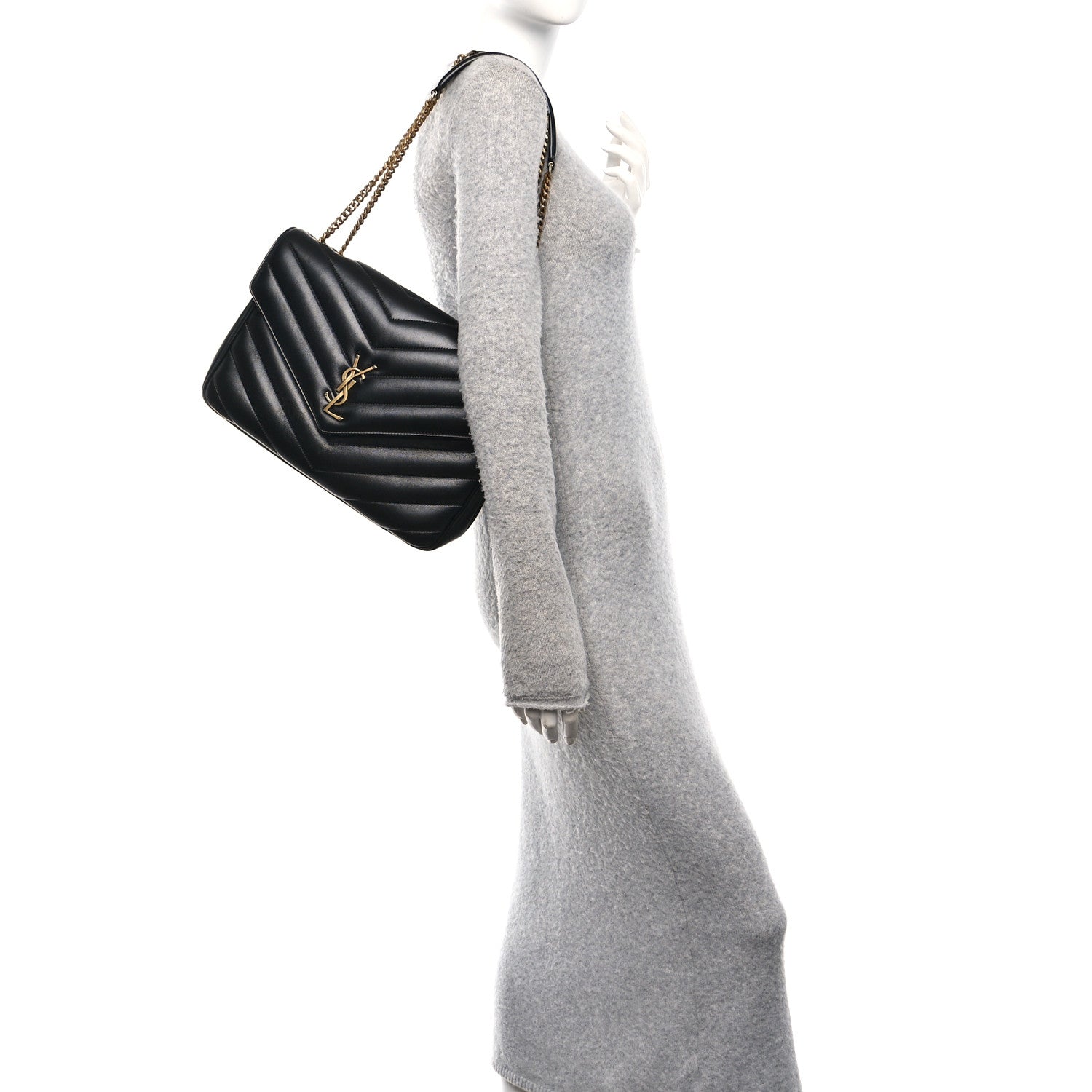 Black quilted shoulder bag on gold chain strap with YSL emblem