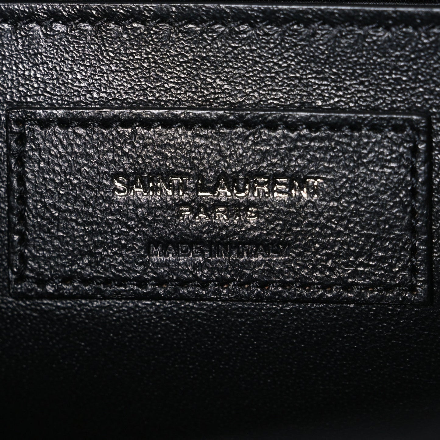 Saint Laurent black leather satchel label stamp on inner panel