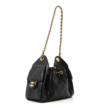 Black leather quilted mini handbag with gold chain handle and Chanel CC front