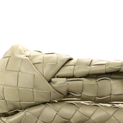 Small woven lambskin leather bag with top woven panels and wrapped strap