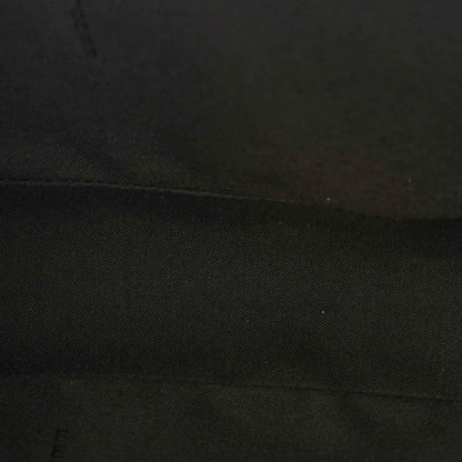 Fendi baguette bag lining close-up in dark fabric with subtle texture